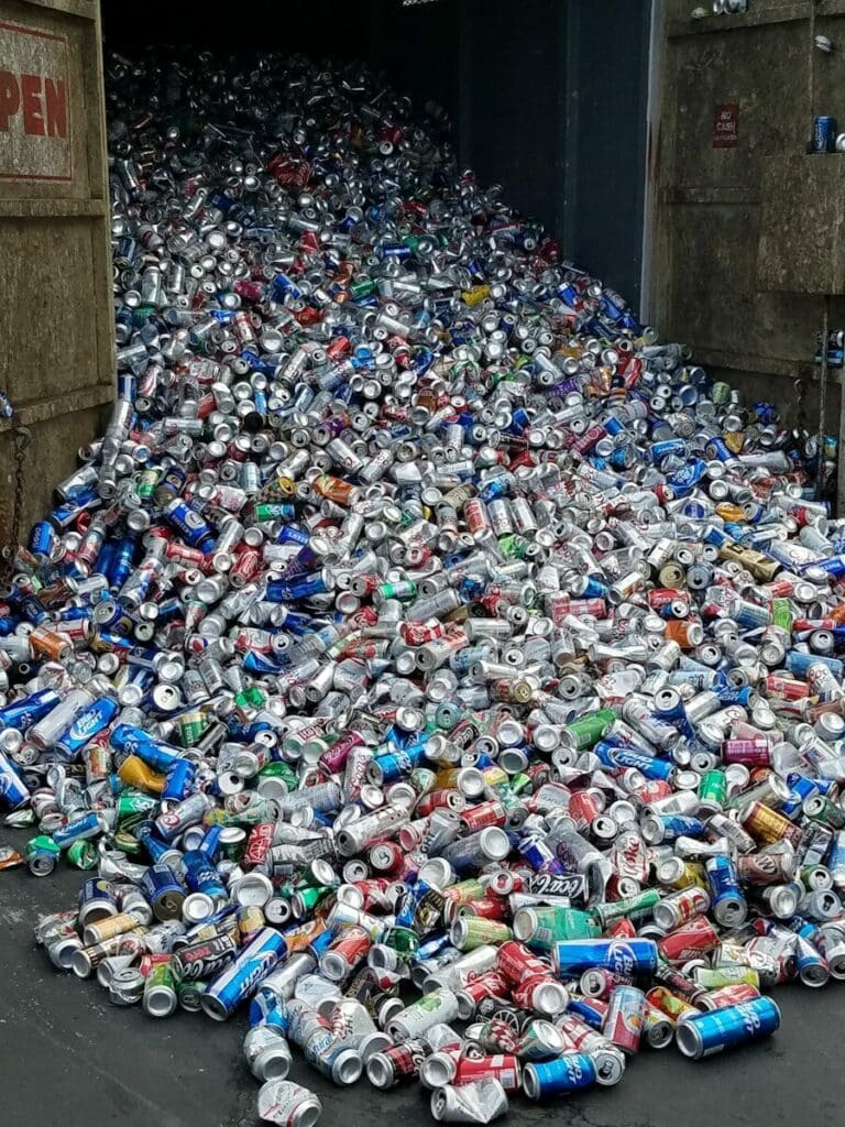 A large pile of crushed aluminum cans
