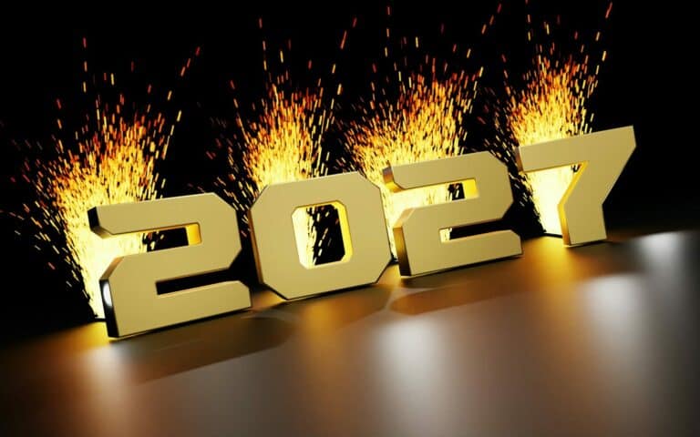 Golden 2027 numbers with bright sparks bursting behind on a dark surface
